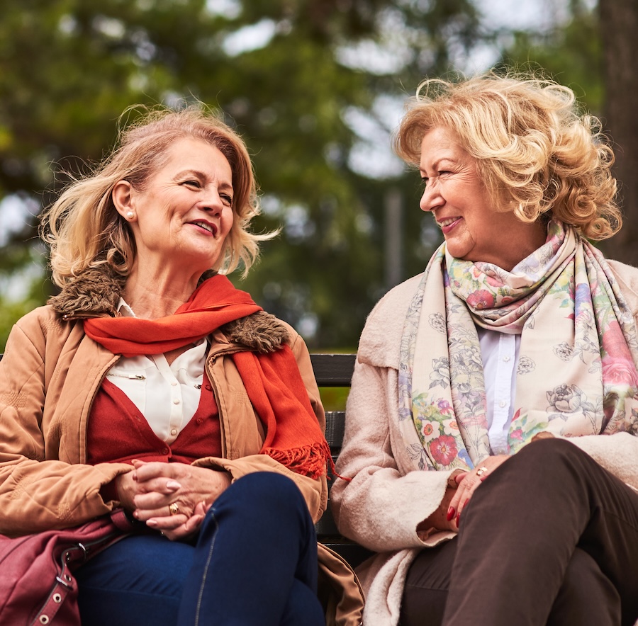 Two women smiling outdoors